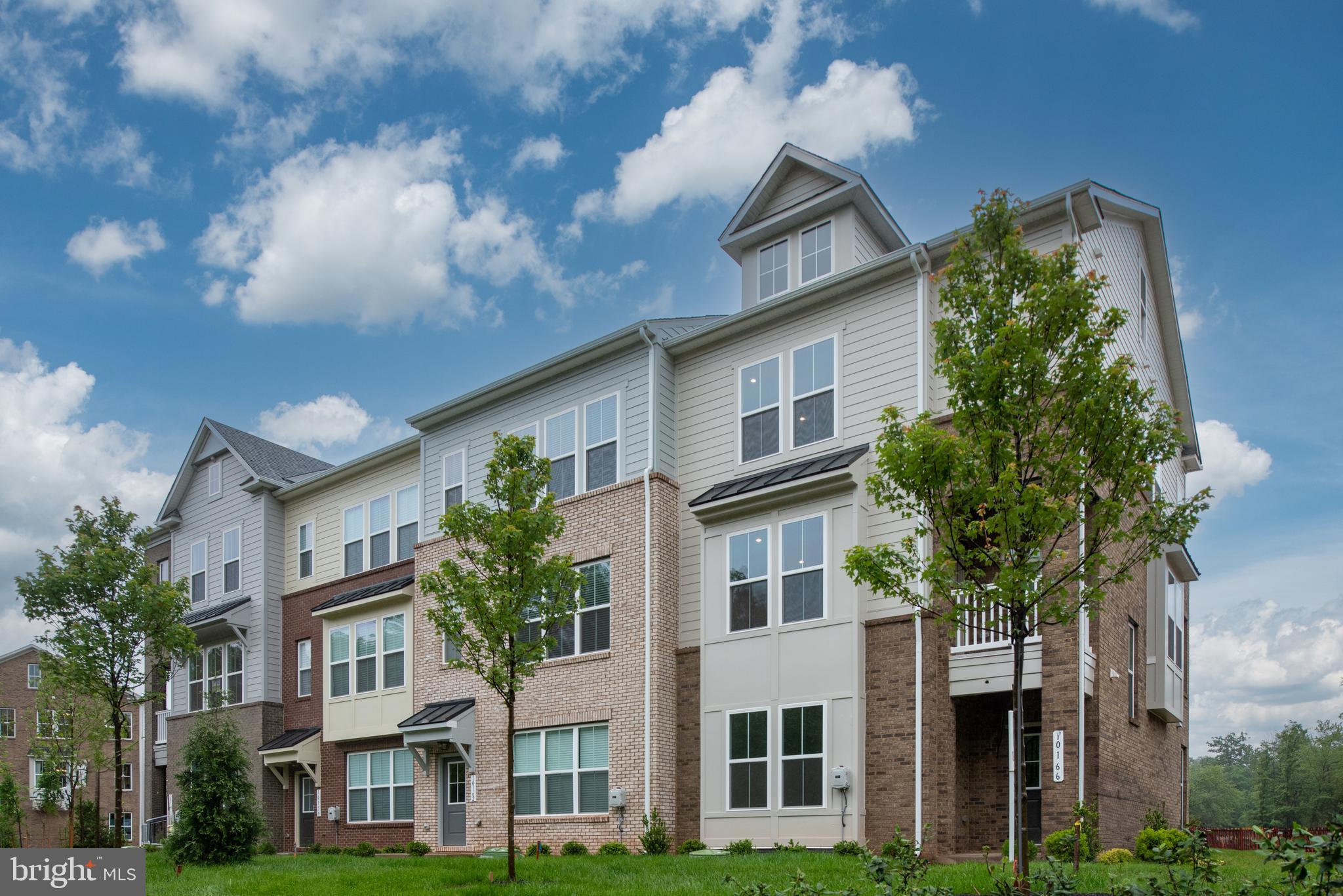 a view of a big yard in front of a brick building
