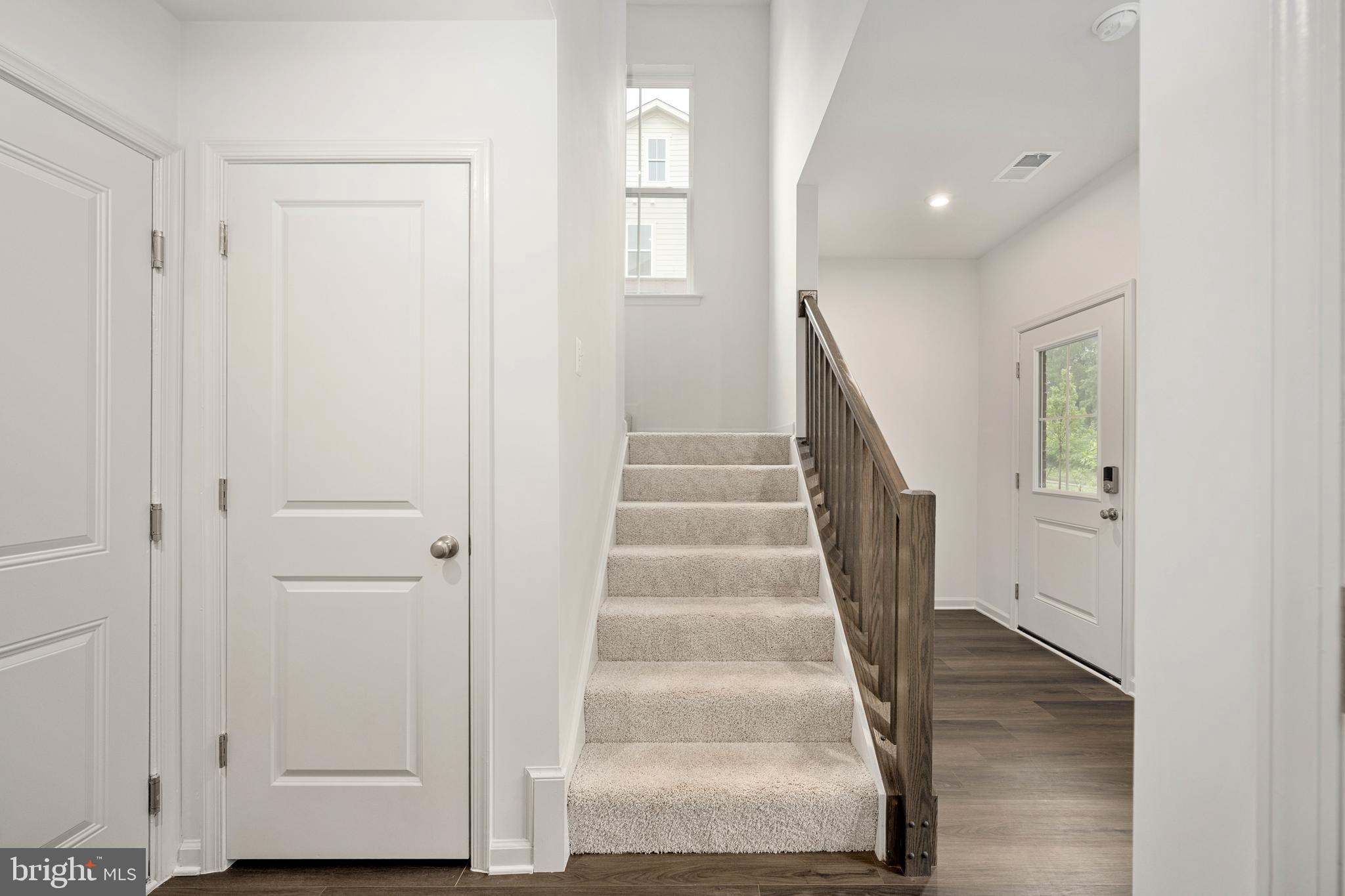 10114 Queens Way Manassas, VA 20110 - Photo 11 of 56 a view of entryway with wooden floor