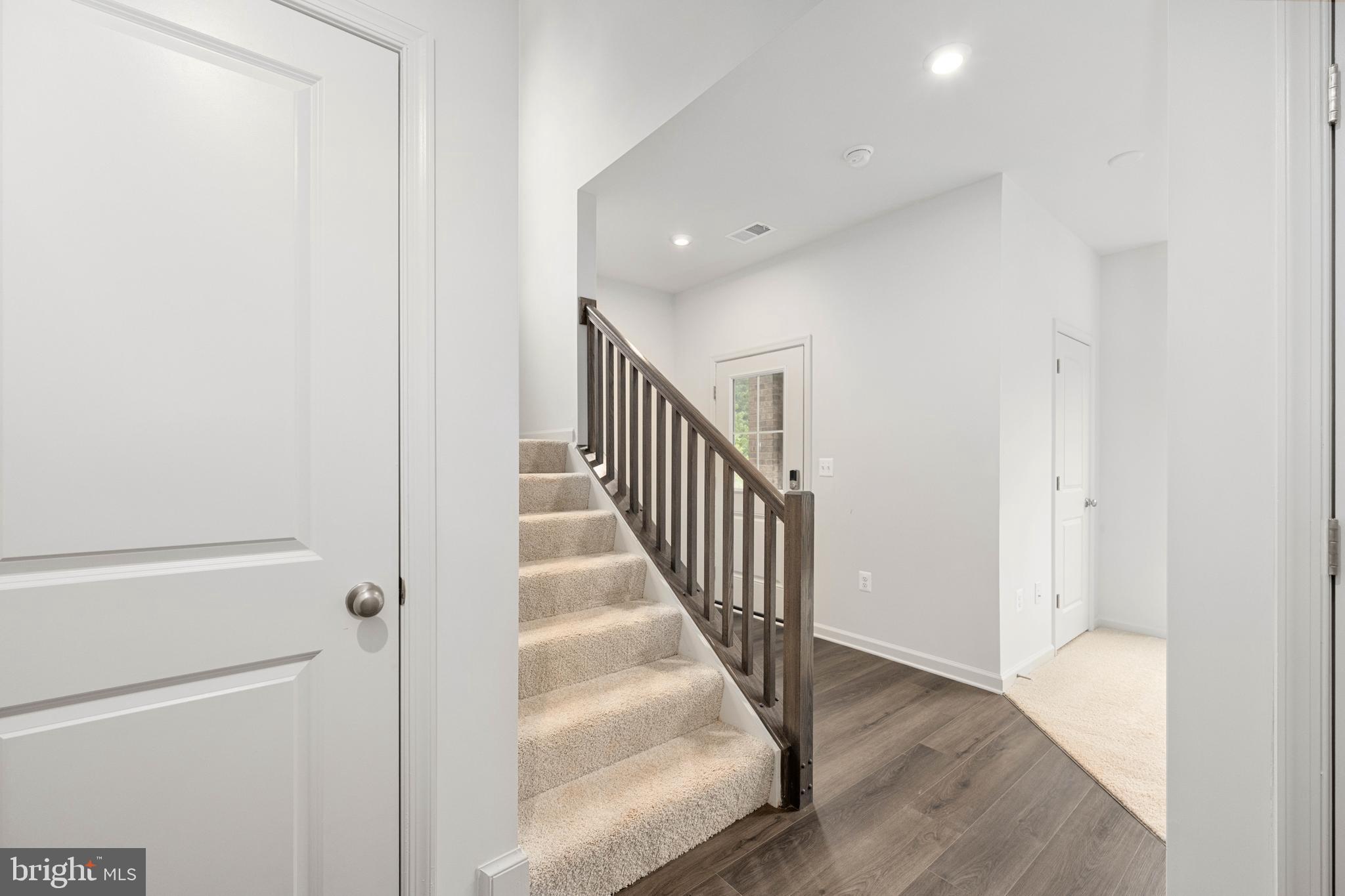 10114 Queens Way Manassas, VA 20110 - Photo 12 of 56 a view of a hallway with wooden floor and entryway
