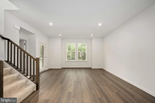 a view of entryway with wooden floor and stair