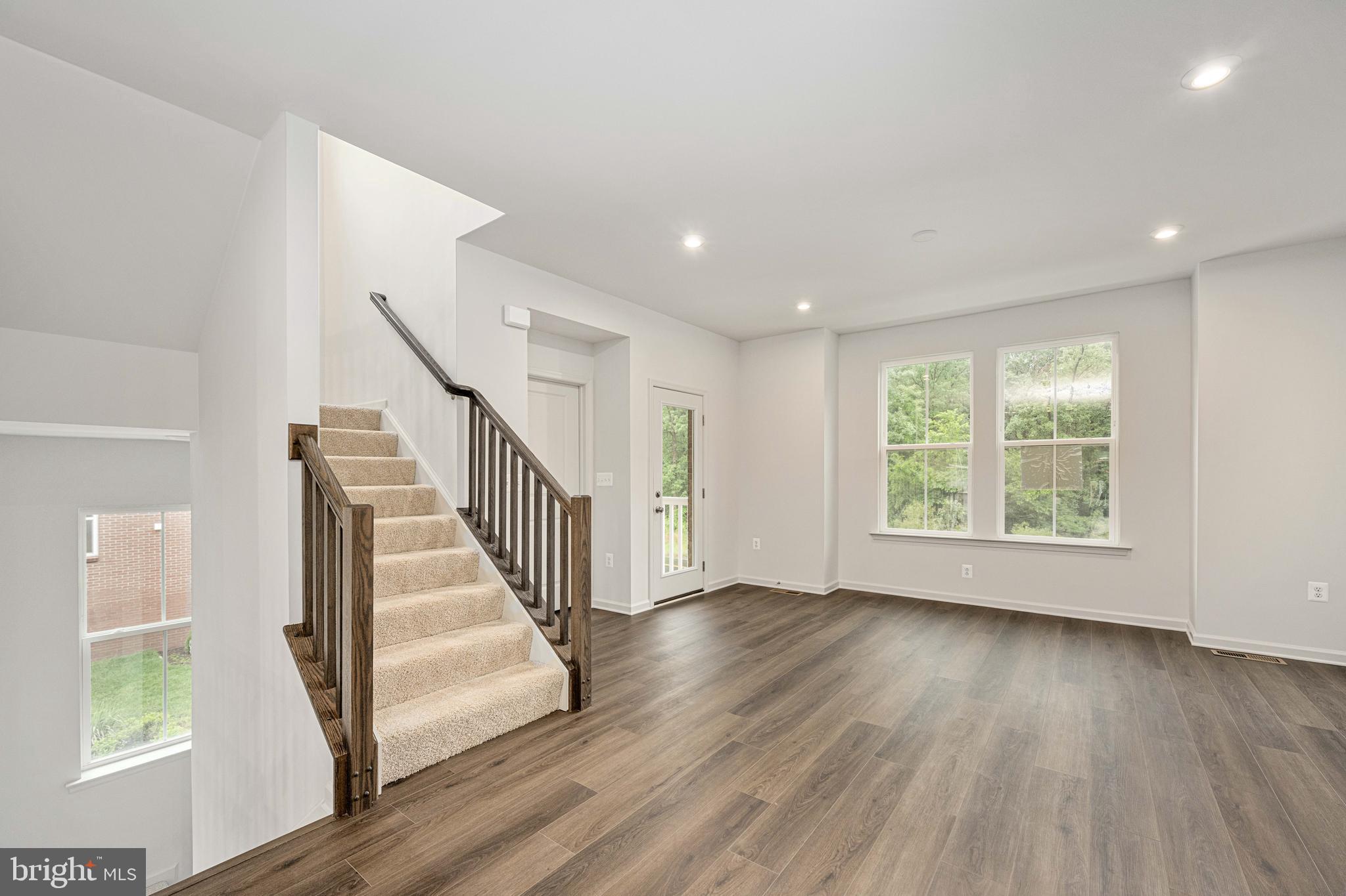 10114 Queens Way Manassas, VA 20110 - Photo 16 of 56 a view of entryway with wooden floor and stair