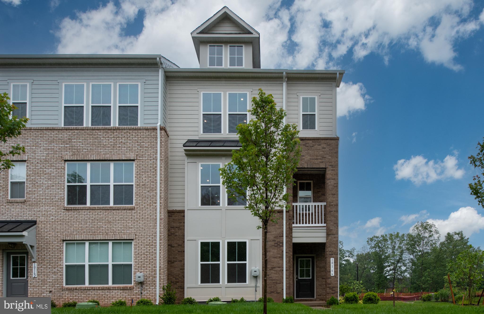10114 Queens Way Manassas, VA 20110 - Photo 2 of 56 front view of house with a tree