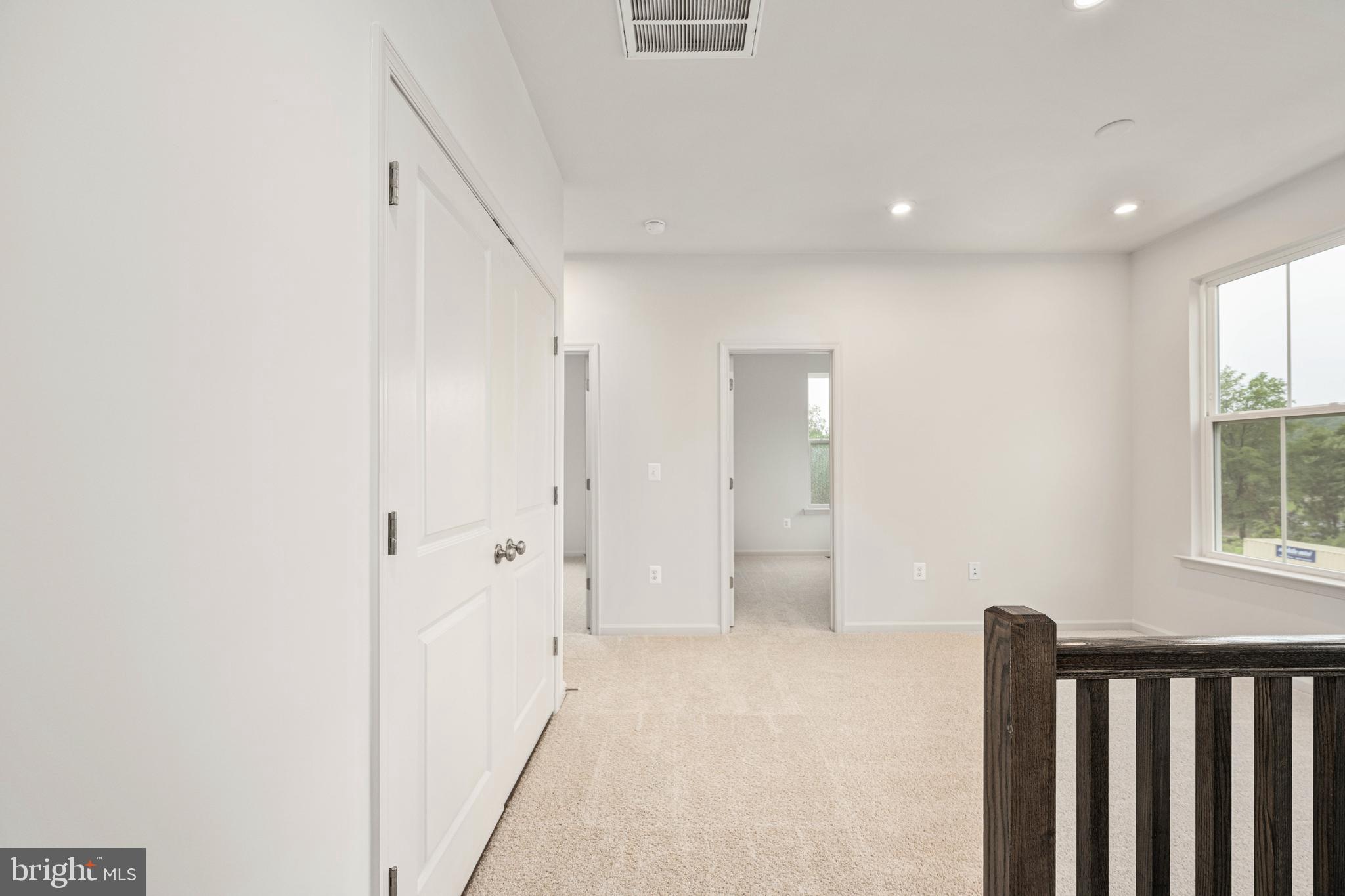 10114 Queens Way Manassas, VA 20110 - Photo 32 of 56 a view of a hallway with a natural light