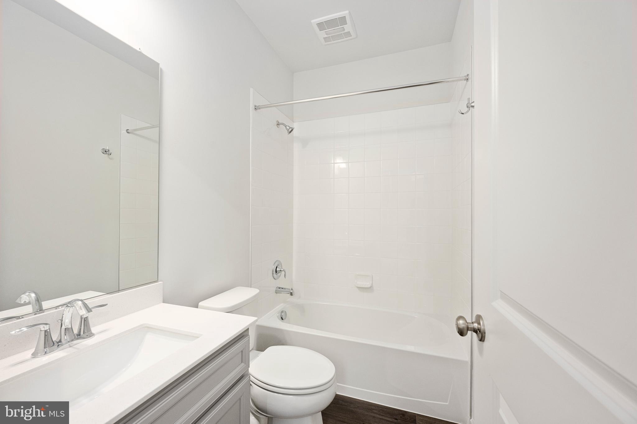 10114 Queens Way Manassas, VA 20110 - Photo 56 of 56 a bathroom with a sink a toilet and shower