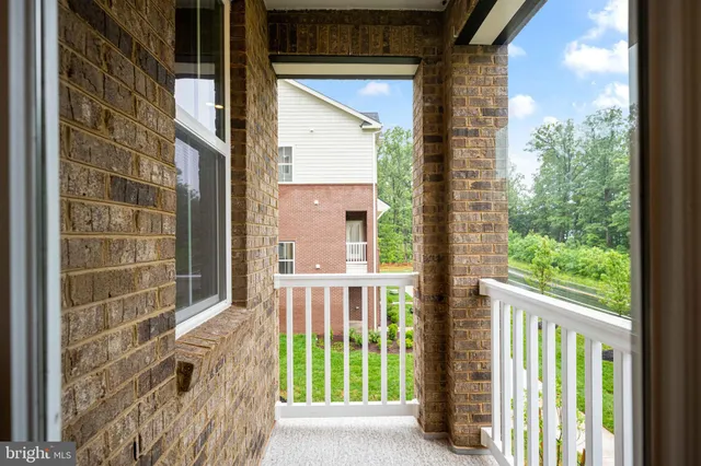 a view of staircase with wooden floor