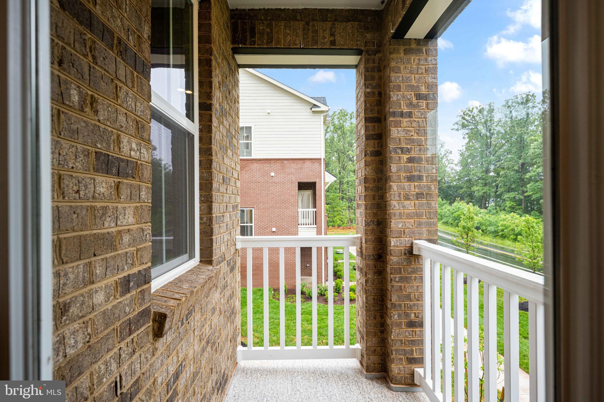 10114 Queens Way Manassas, VA 20110 - Photo 9 of 56 a view of a porch with a floor to ceiling window