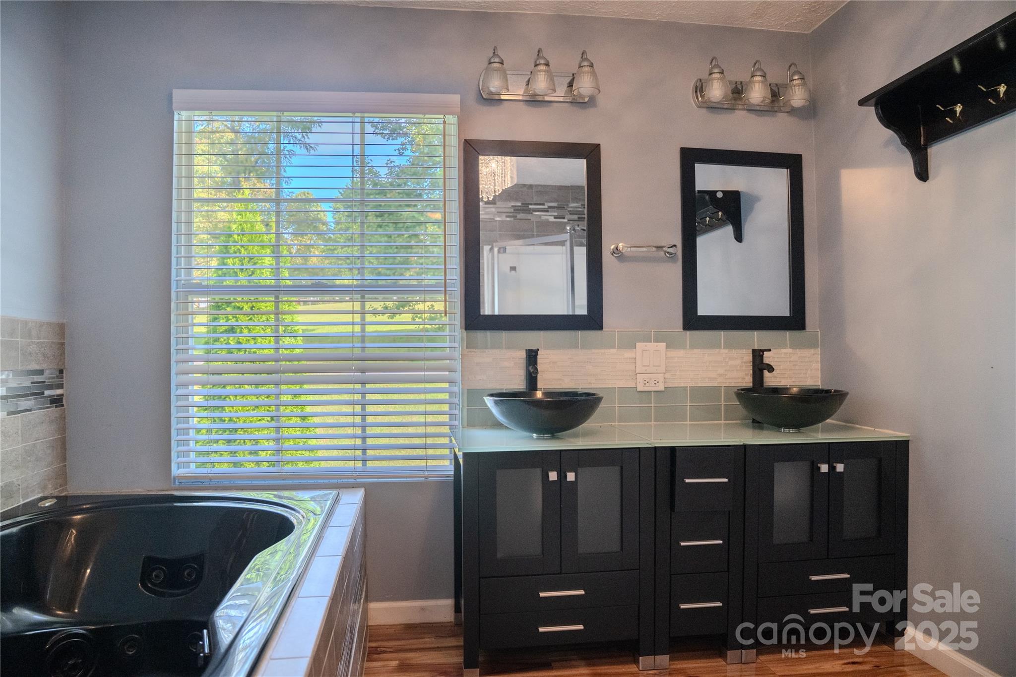 514 King Road Flat Rock, NC 28731 - Photo 20 of 47 a bathroom with double vanity and a bathtub