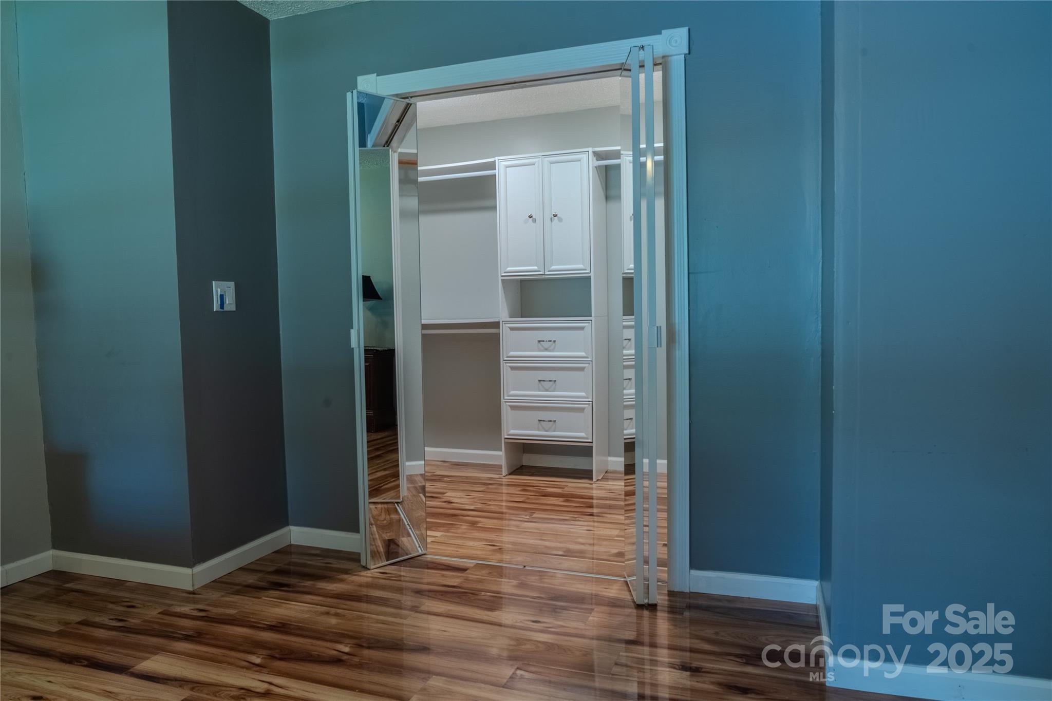 514 King Road Flat Rock, NC 28731 - Photo 23 of 47 a view of a hallway with wooden floor and a bathroom