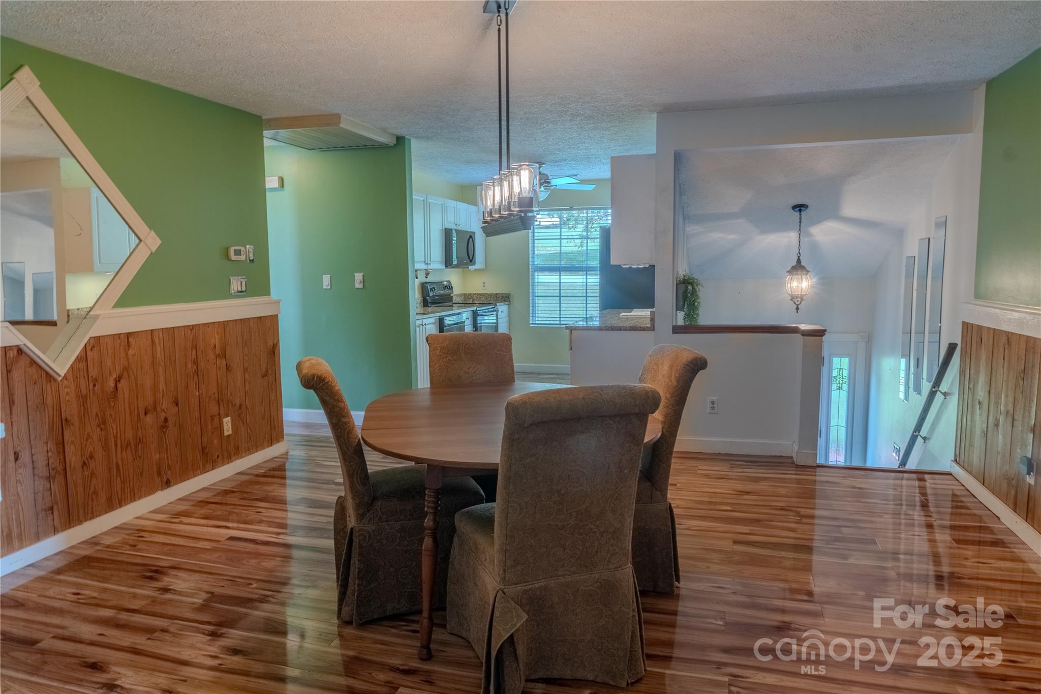 514 King Road Flat Rock, NC 28731 - Photo 27 of 47 a view of a dining room with furniture window and wooden floor
