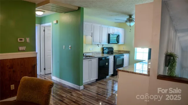 a view of a kitchen with furniture and a window