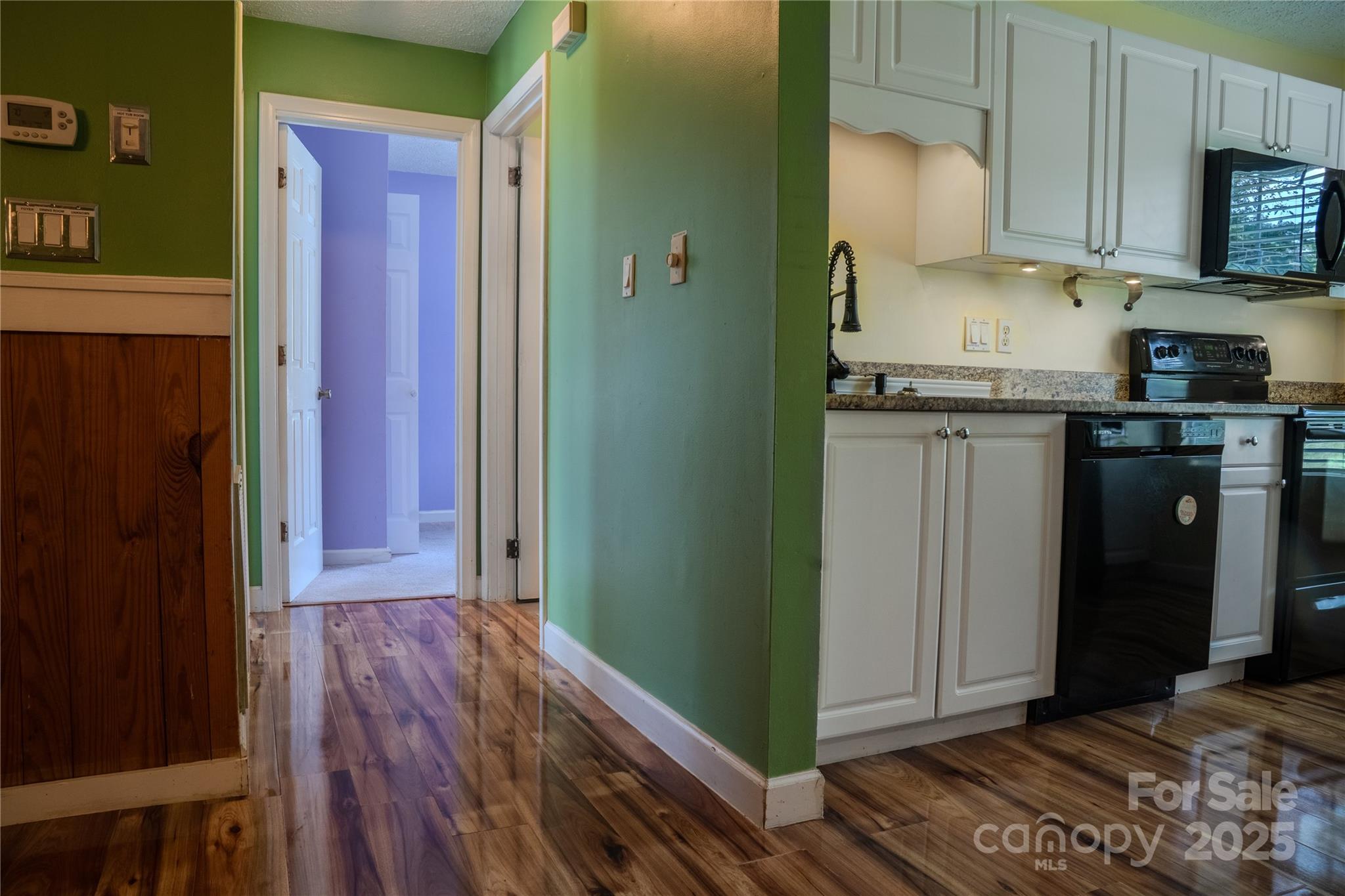 514 King Road Flat Rock, NC 28731 - Photo 29 of 47 a kitchen with granite countertop a refrigerator and a stove top oven