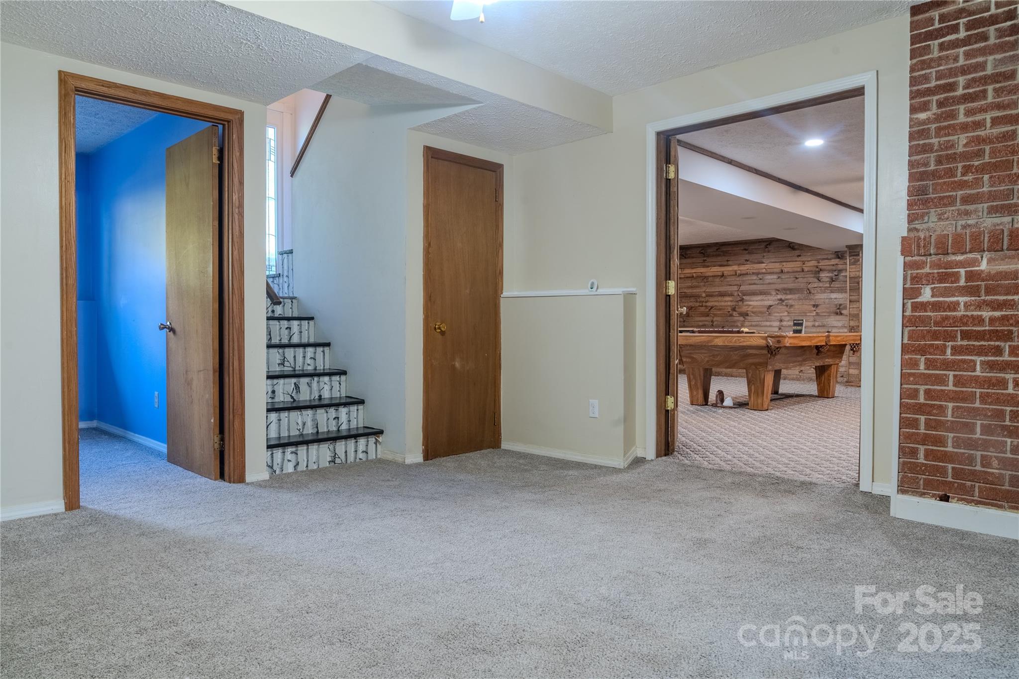 514 King Road Flat Rock, NC 28731 - Photo 39 of 47 a view of an empty room with stairs and a fireplace