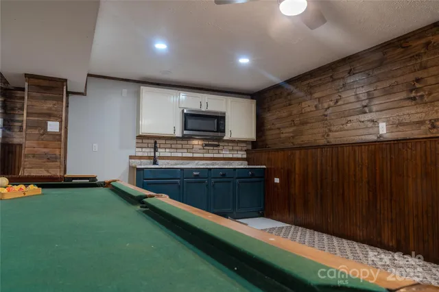a kitchen with stainless steel appliances wooden cabinets a stove and a refrigerator