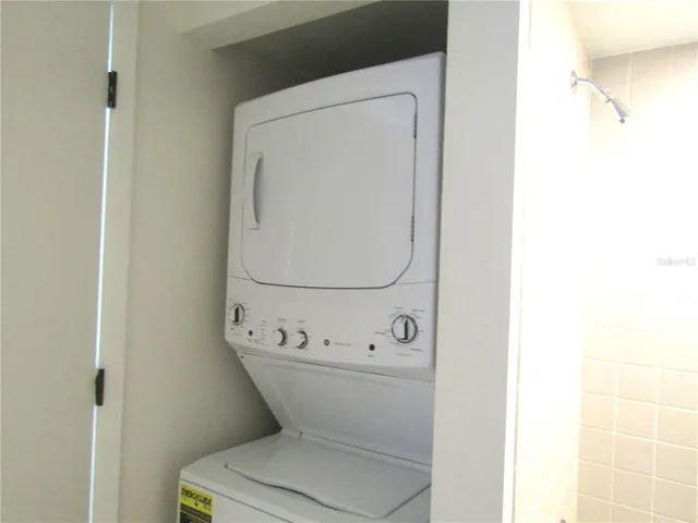 a white toilet sitting next to a white sink