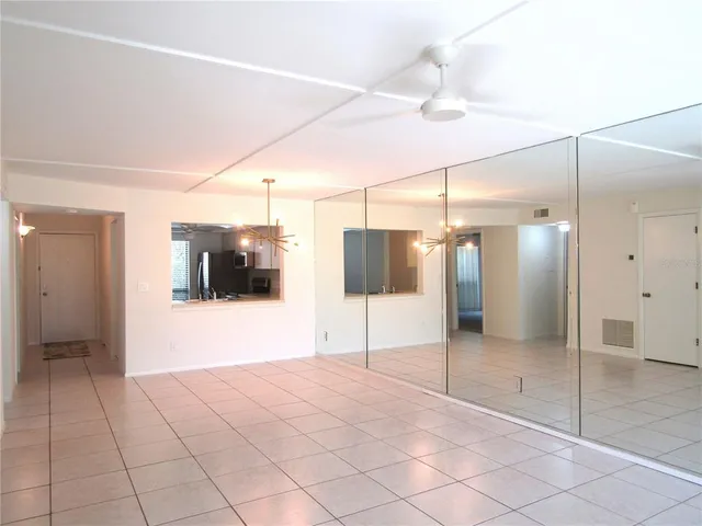 a view of a bathroom with a shower and a room