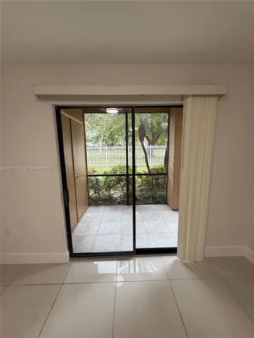 a bathroom with a glass door and shower