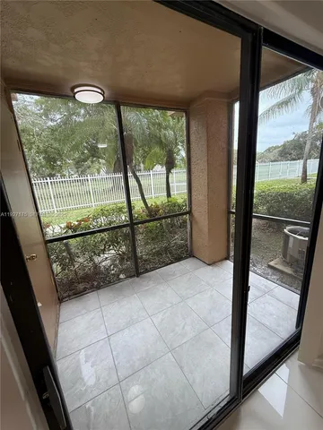 a view of a glass door with a large window