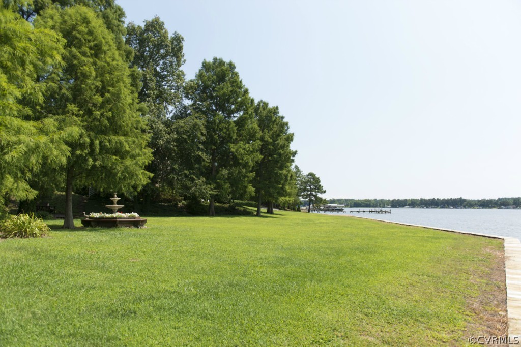 722 Point Anne Drive Hartfield, VA 23071 - Photo 13 of 21 a view of a swimming pool and lake view