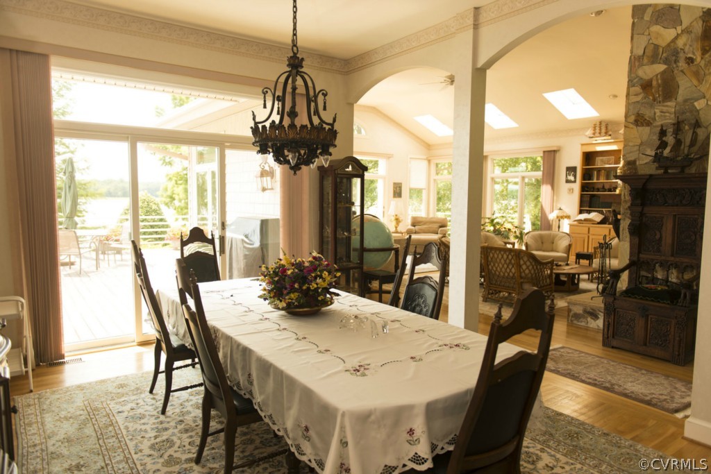 722 Point Anne Drive Hartfield, VA 23071 - Photo 17 of 21 a view of a dining room with furniture window and outside view