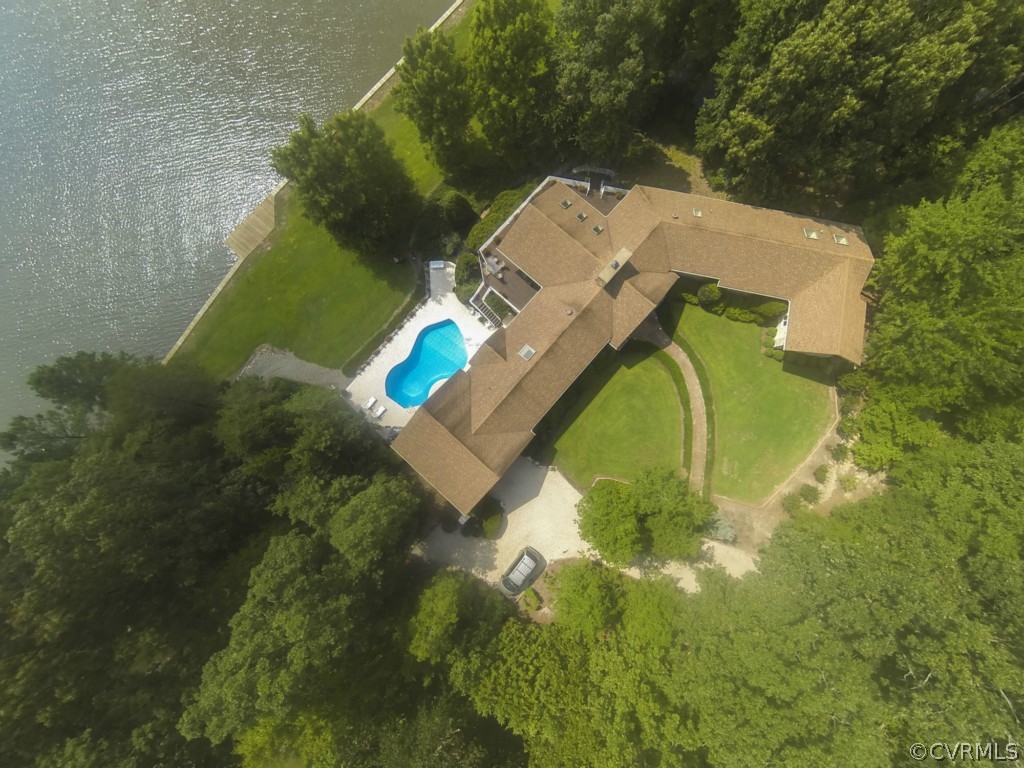 722 Point Anne Drive Hartfield, VA 23071 - Photo 2 of 21 a view of a house with a backyard and trees