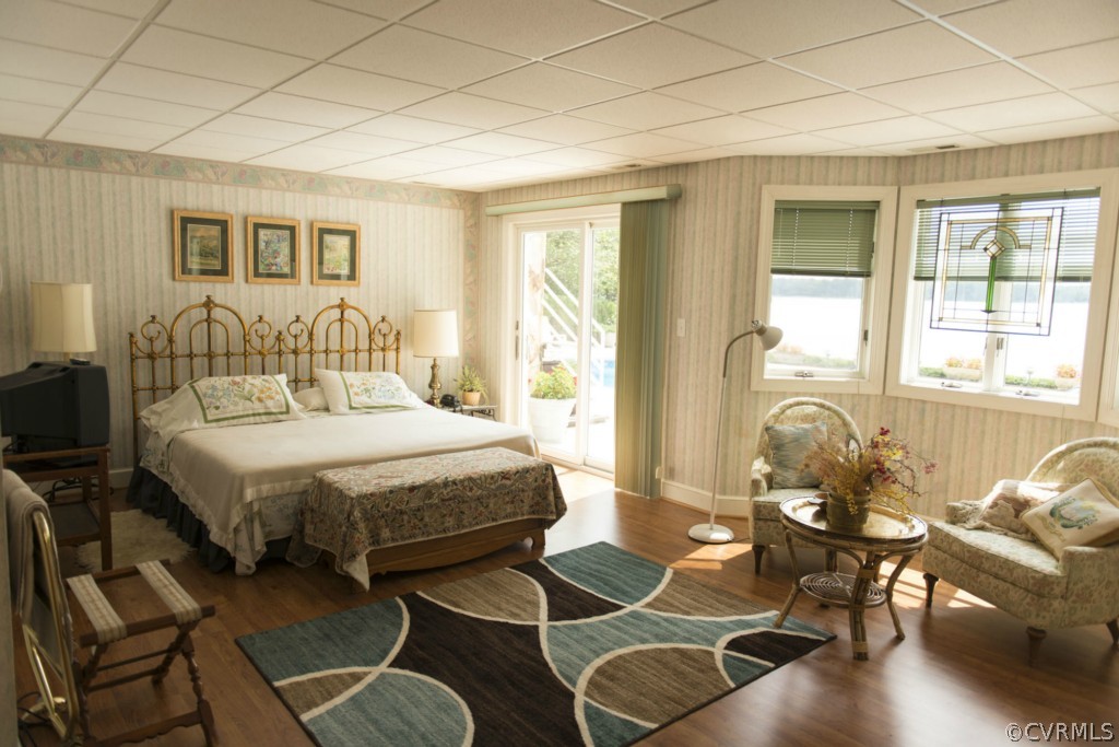 722 Point Anne Drive Hartfield, VA 23071 - Photo 21 of 21 a spacious bedroom with a bed and wooden floor