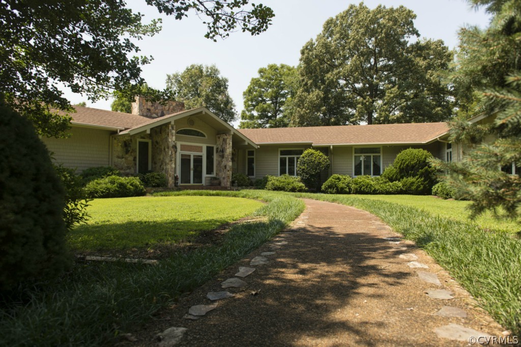 722 Point Anne Drive Hartfield, VA 23071 - Photo 3 of 21 a front view of a house with a yard