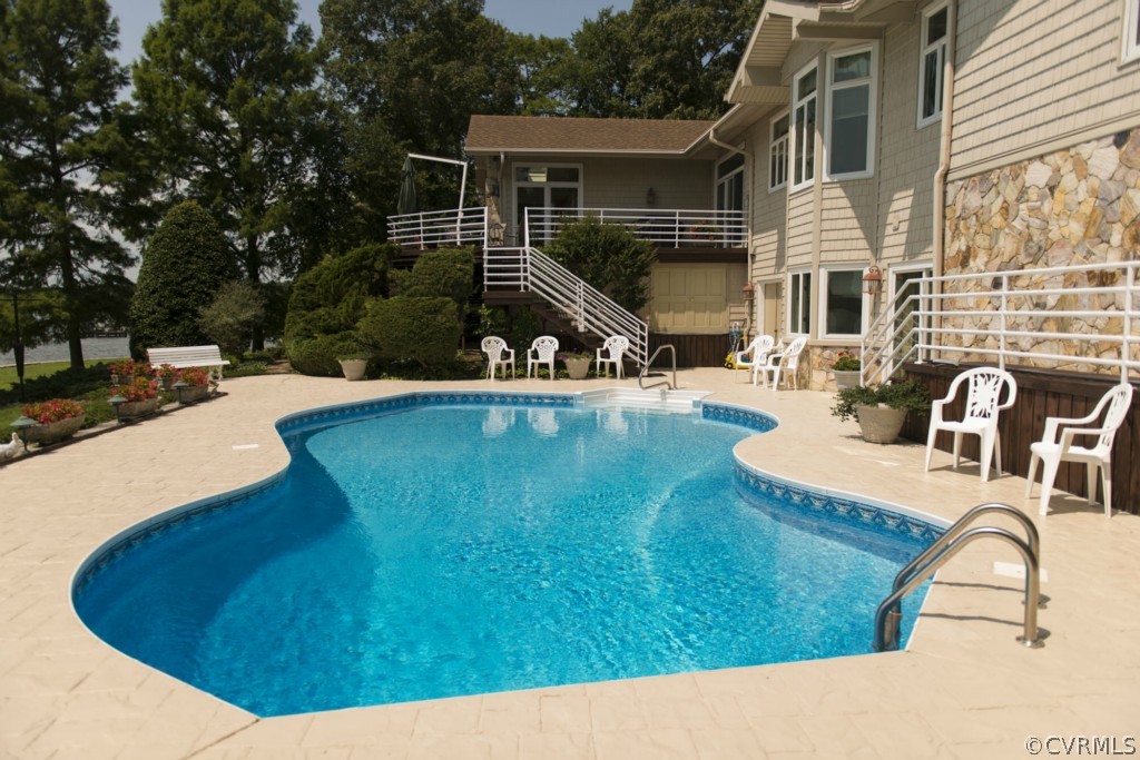 722 Point Anne Drive Hartfield, VA 23071 - Photo 8 of 21 a view of a house with swimming pool