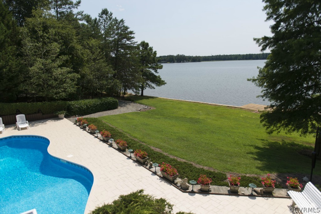 722 Point Anne Drive Hartfield, VA 23071 - Photo 9 of 21 a view of a lake with a yard