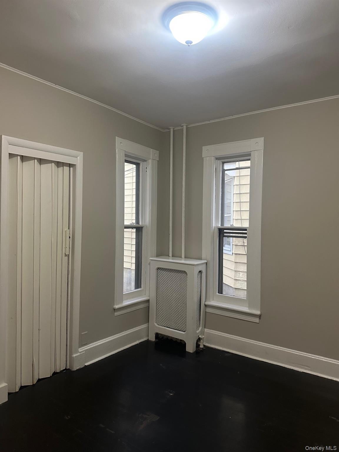 25 Virginia Avenue, Unit 1 Poughkeepsie, NY 12601 - Photo 10 of 11 an empty room with windows