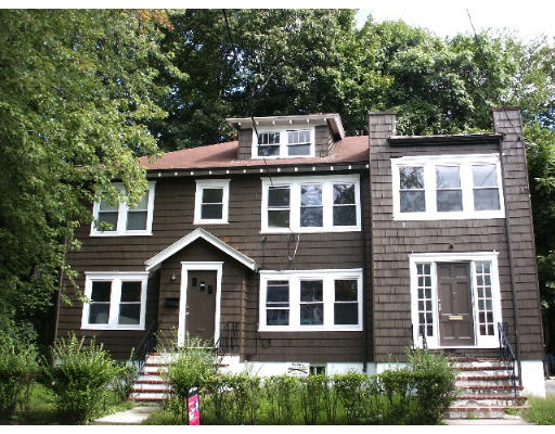37-39 Beaconsfield Road Brookline, MA 02445 - Photo 1 of 2 a front view of a house with a yard