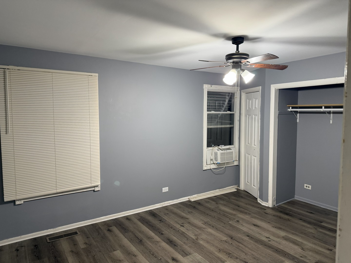 429 South Street, Unit 1 Elgin, IL 60123 - Photo 6 of 17 an empty room with windows and fan