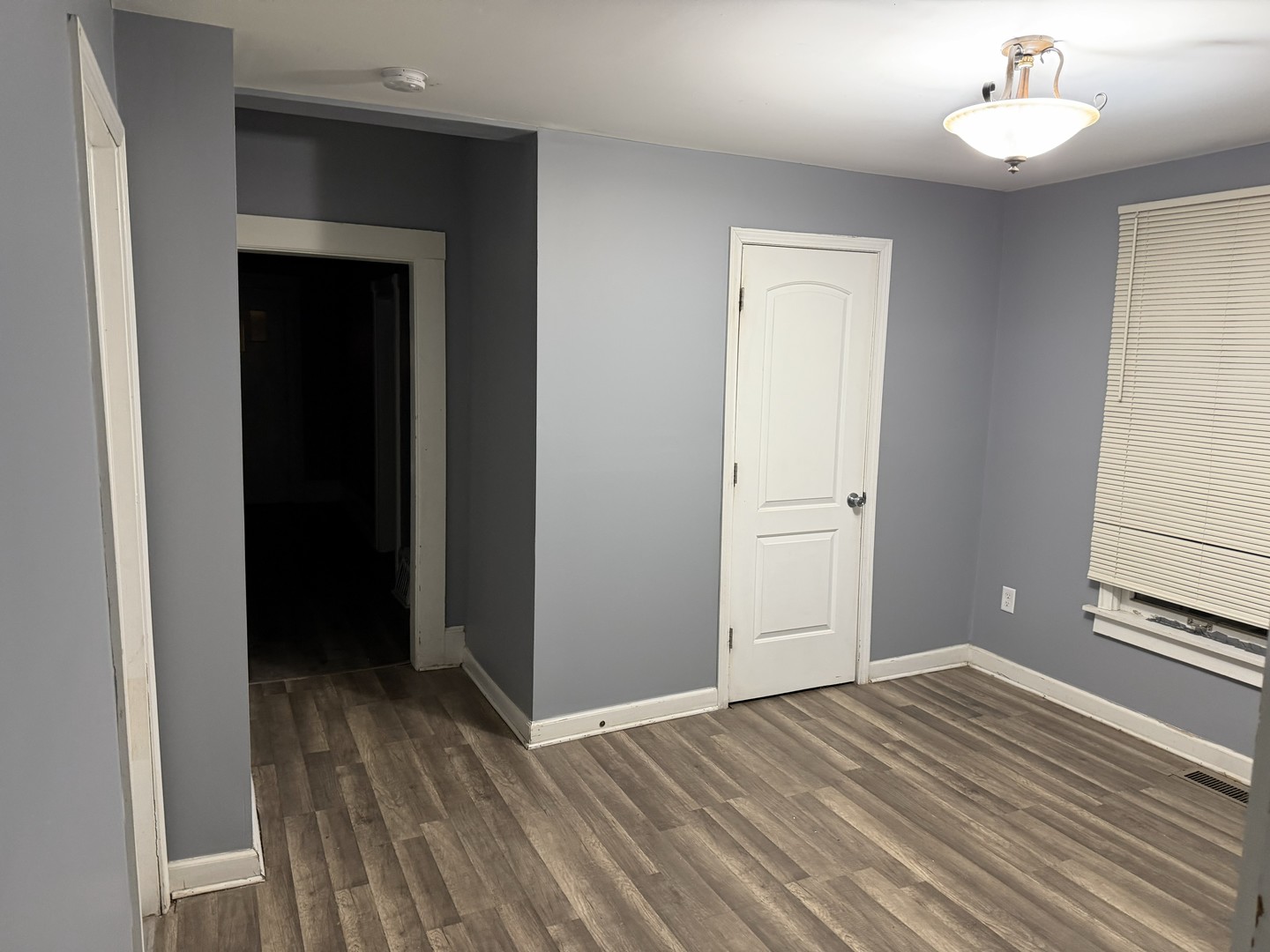 429 South Street, Unit 1 Elgin, IL 60123 - Photo 8 of 17 a view of a room with wooden floor and closet