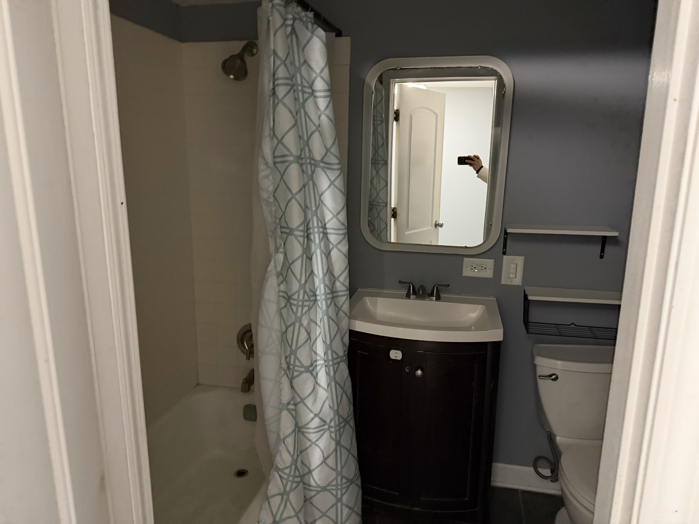 429 South Street, Unit 1 Elgin, IL 60123 - Photo 10 of 17 a bathroom with a sink and a mirror
