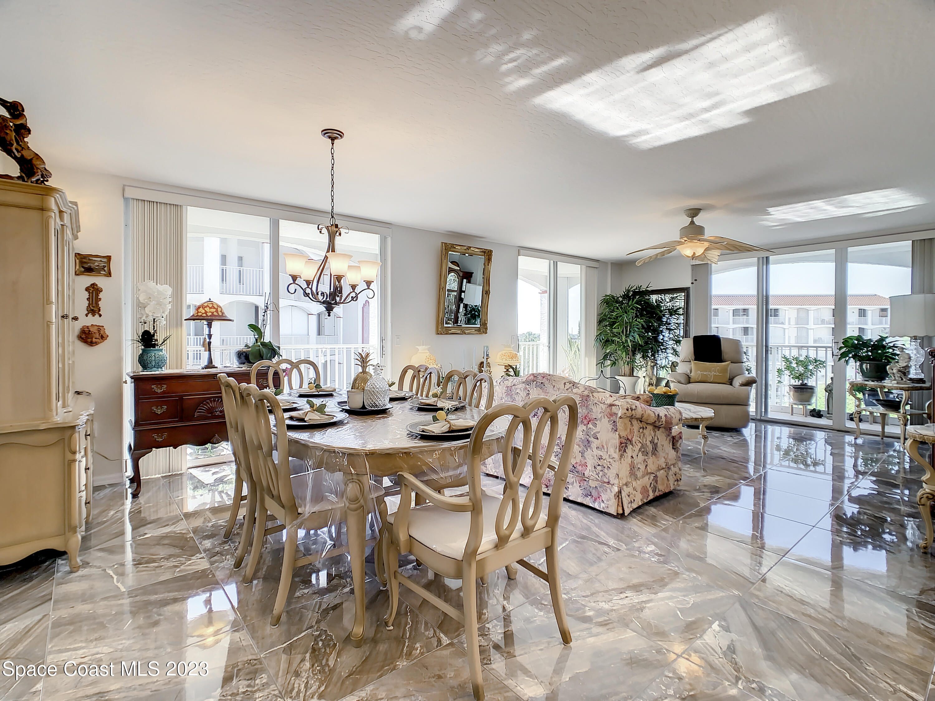 821 Del Rio Way, Unit 504 Merritt Island, FL 32953 - Photo 6 of 37 a view of a dining room with furniture window and outside view