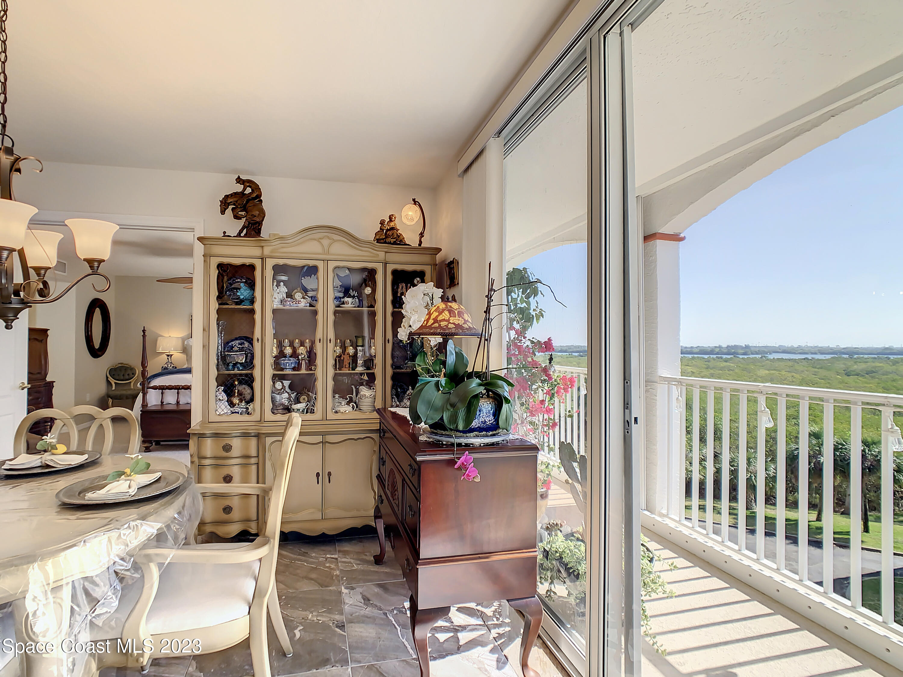 821 Del Rio Way, Unit 504 Merritt Island, FL 32953 - Photo 7 of 37 a view of a living room with furniture and entryway