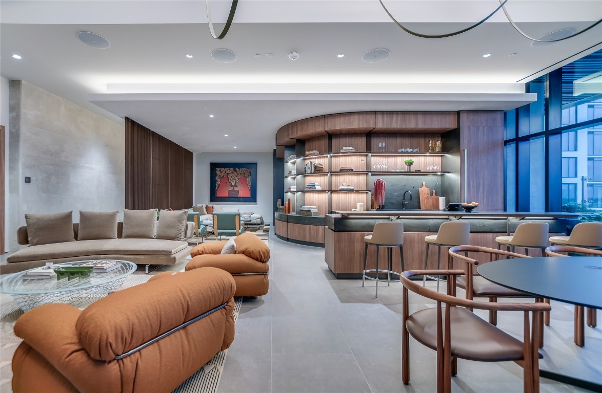 610 Davis Street, Unit 4305 Austin, TX 78701 - Photo 17 of 24 a living room with furniture a window and kitchen view