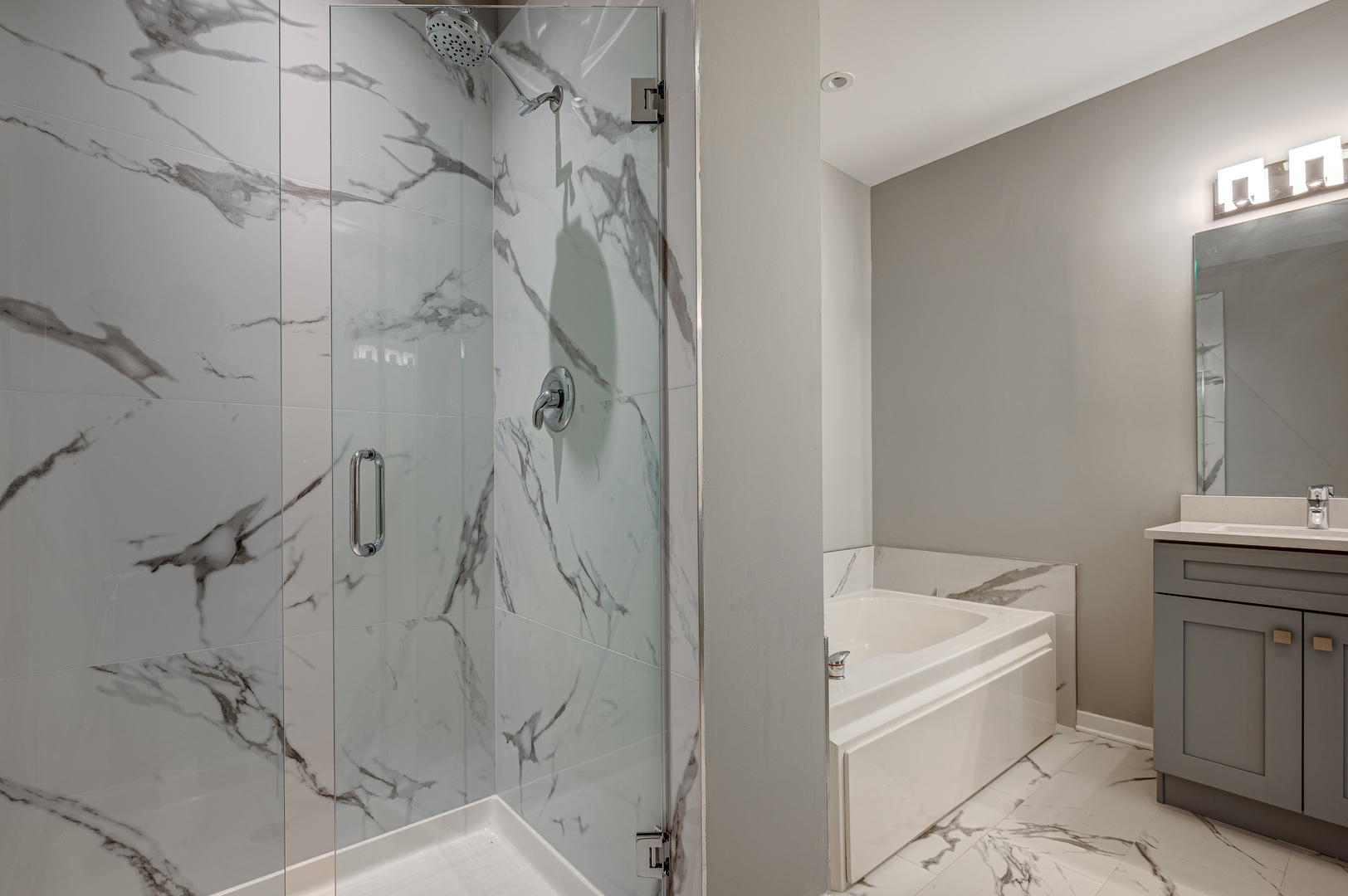 1038 South Racine Avenue, Unit 301 Chicago, IL 60607 - Photo 16 of 24 a bathroom with a bathtub and shower