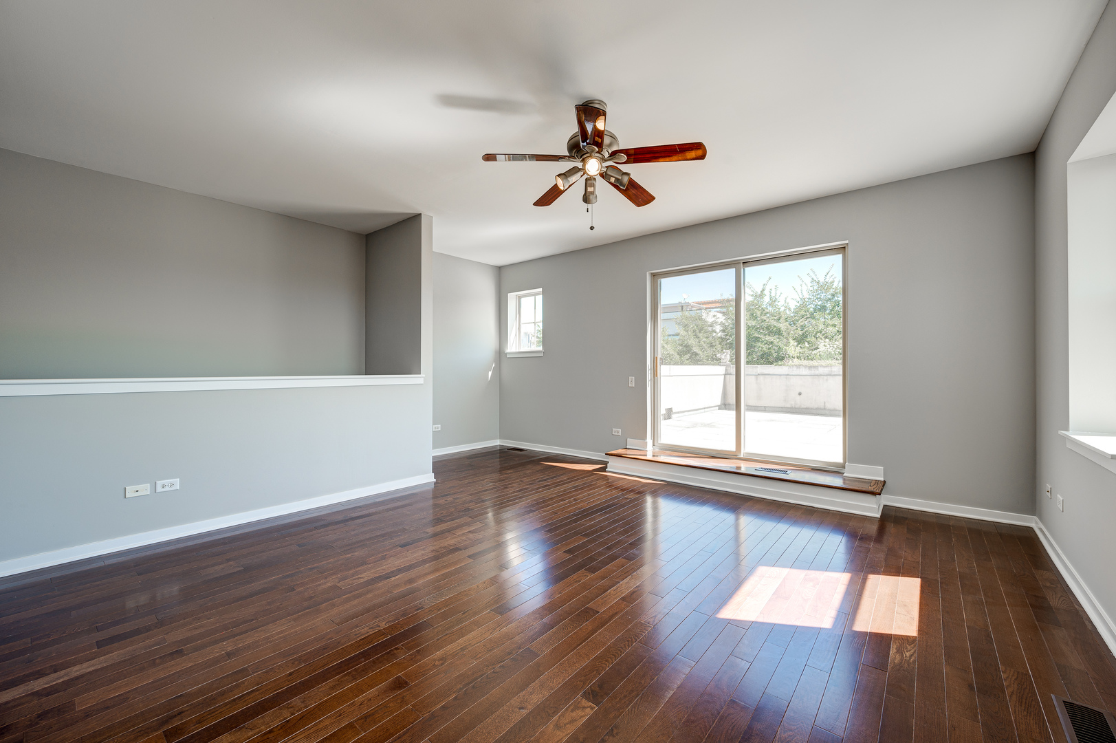 1038 South Racine Avenue, Unit 301 Chicago, IL 60607 - Photo 19 of 24 wooden floor in an empty room with a window