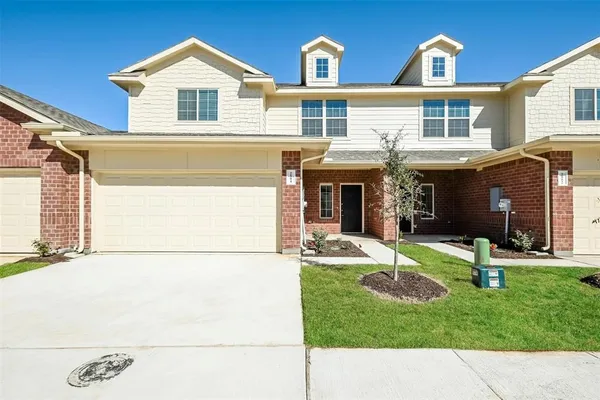 a view of house with yard