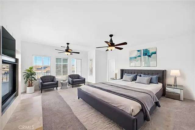 a bedroom with a bed and a potted plant