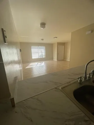 a view of a kitchen with a sink