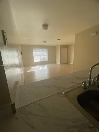 a view of a kitchen with a sink