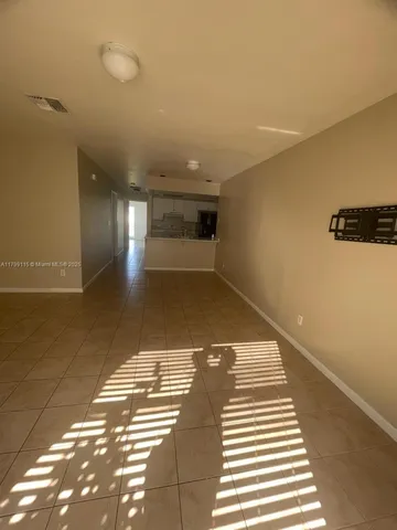 a view of a hallway with windows