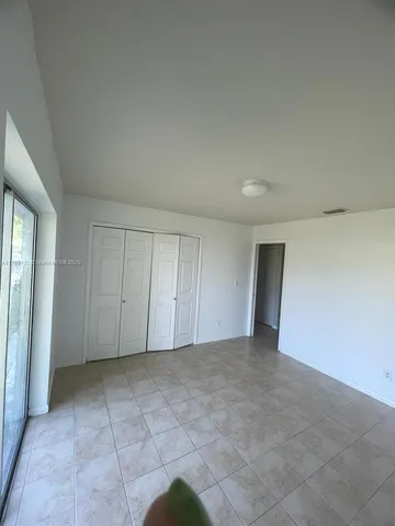 an empty room with a bathroom