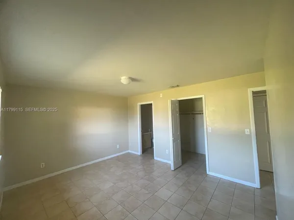 an empty room and closet area