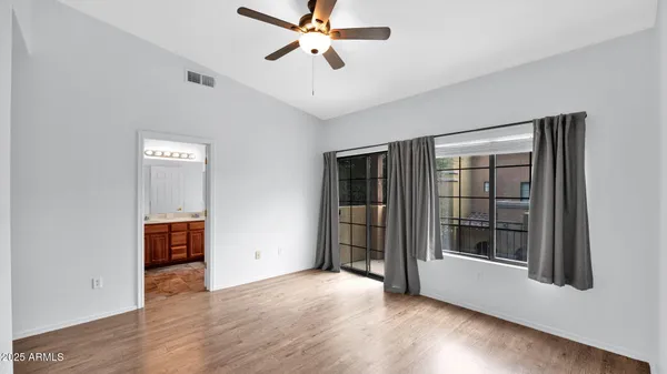 a spacious bathroom with a sink mirror and a bathtub