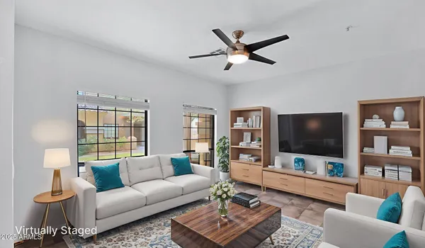 a living room with furniture and a flat screen tv