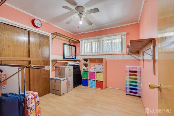 a view of a bedroom with workspace and a window