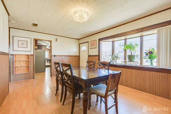 a dining room with furniture window wooden floor