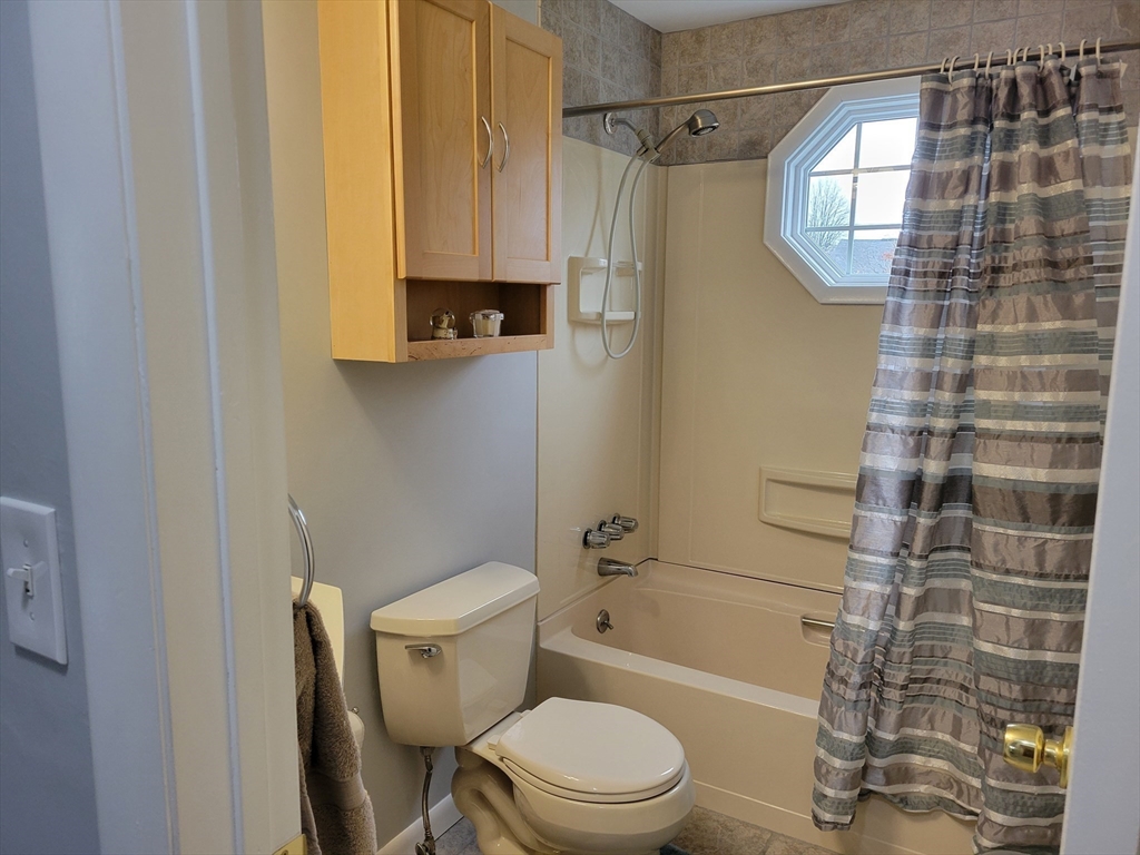 39 Daley Street Chicopee, MA 01013 - Photo 12 of 17 a bathroom with a toilet a sink and bathtub